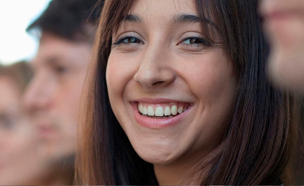 smiling woman in a group of students