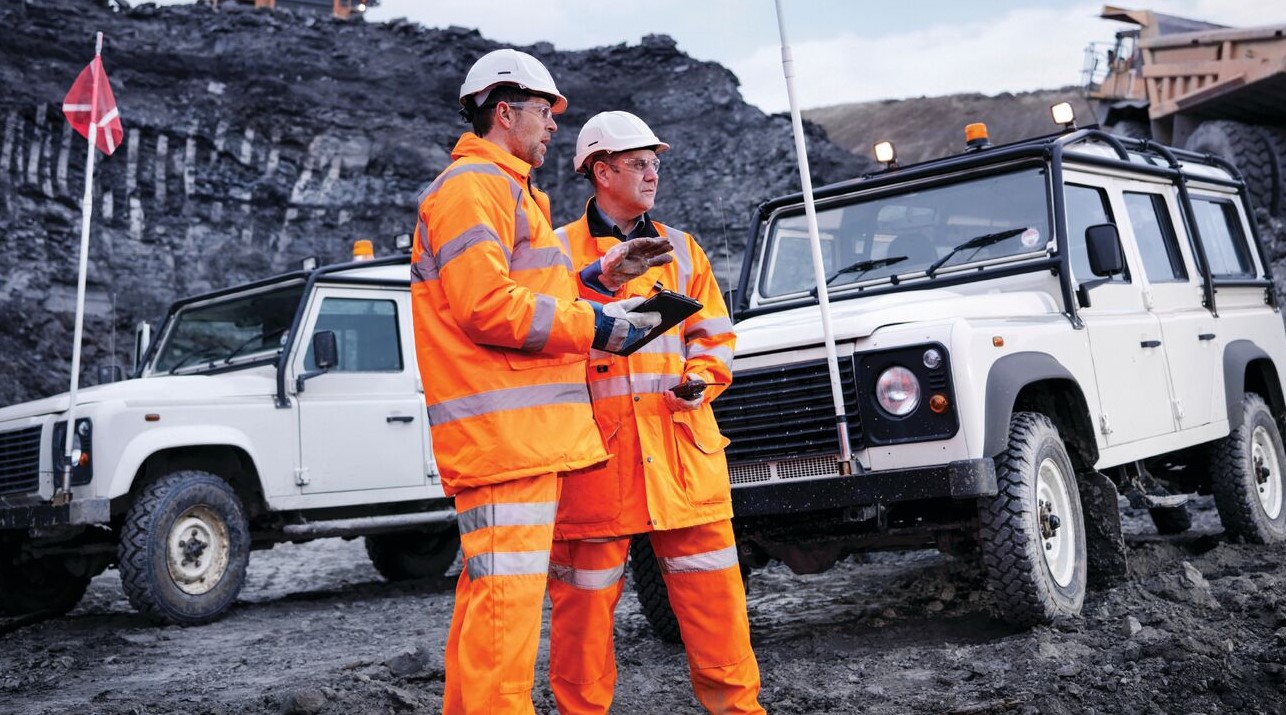 Two members of the crew working on the site