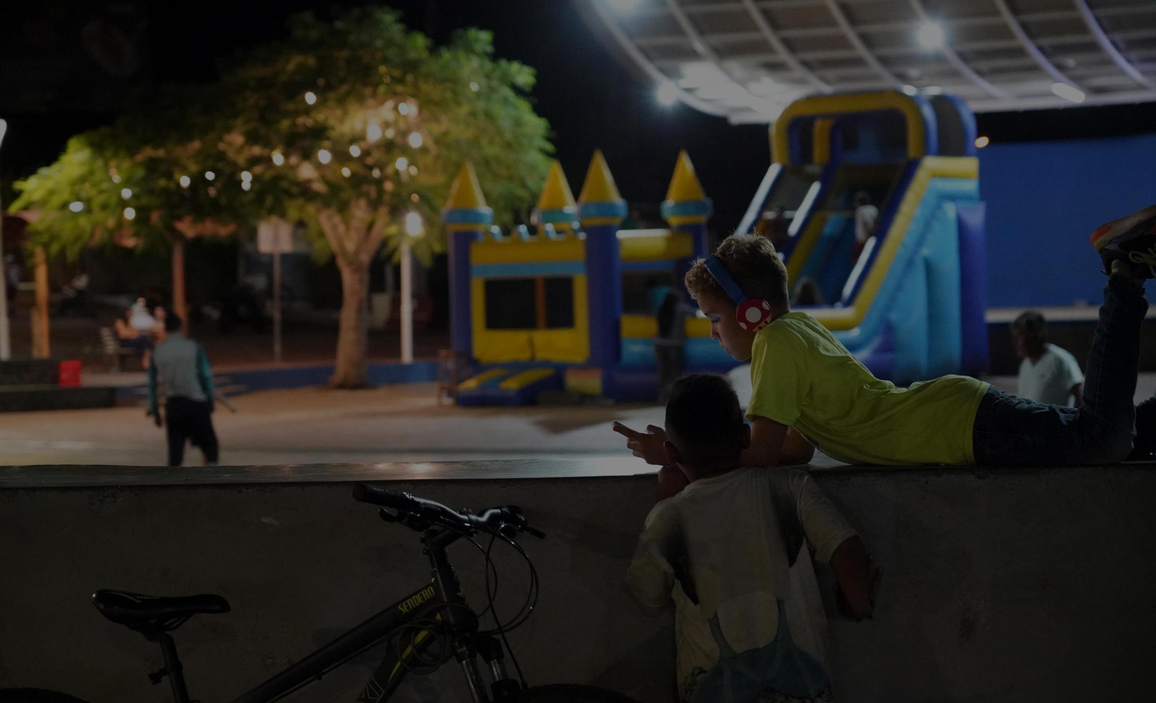 Two Galapagos island kids on a playground