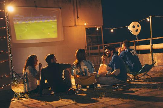 People watching tv on rooftop