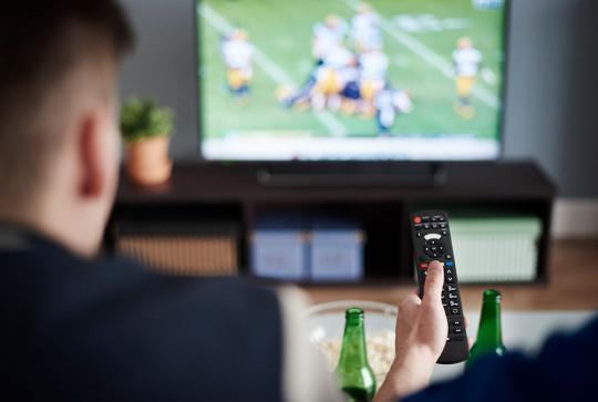 friends watching match on tv