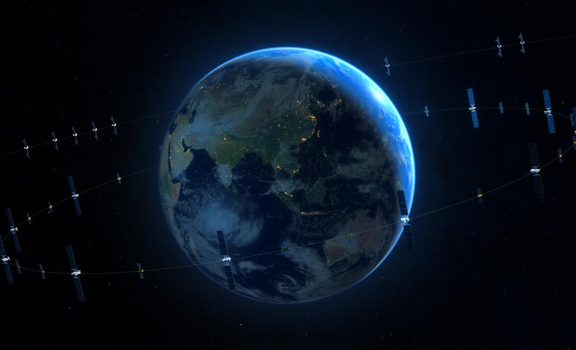 Picture of earth from space, surrounded by orbiting satellites.