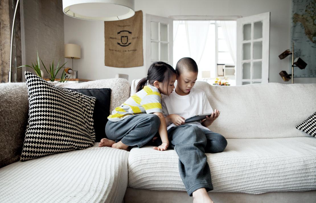 Image of children watching film on tablet