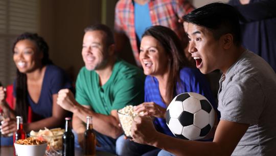 Friends watching football on tv