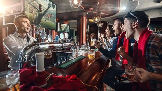 People watching football in a pub