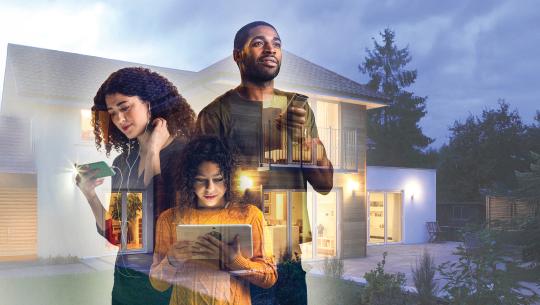 Three people using digital devices, symbolizing connectivity and technology at home.