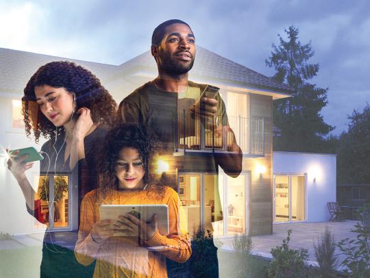 Three people using digital devices, symbolizing connectivity and technology at home.