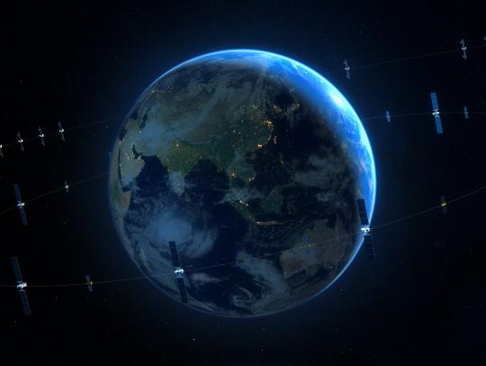 Picture of earth from space, surrounded by orbiting satellites.