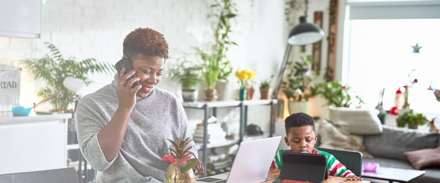 Woman and child with multiple devices banner