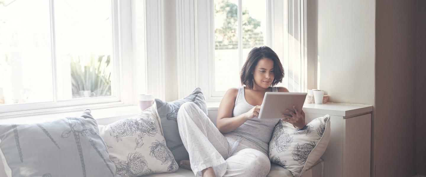Woman on couch with laptop