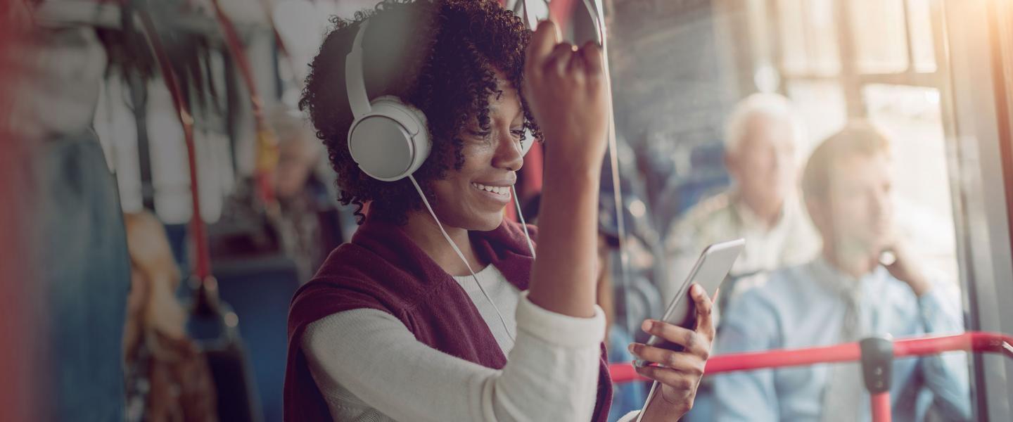 Woman with phone on bus