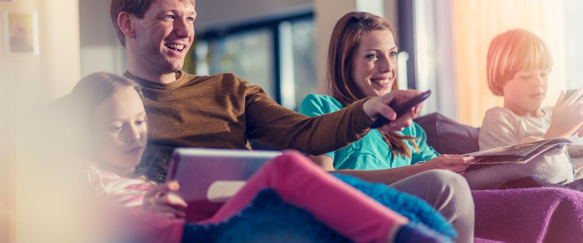 parents with children watching tv