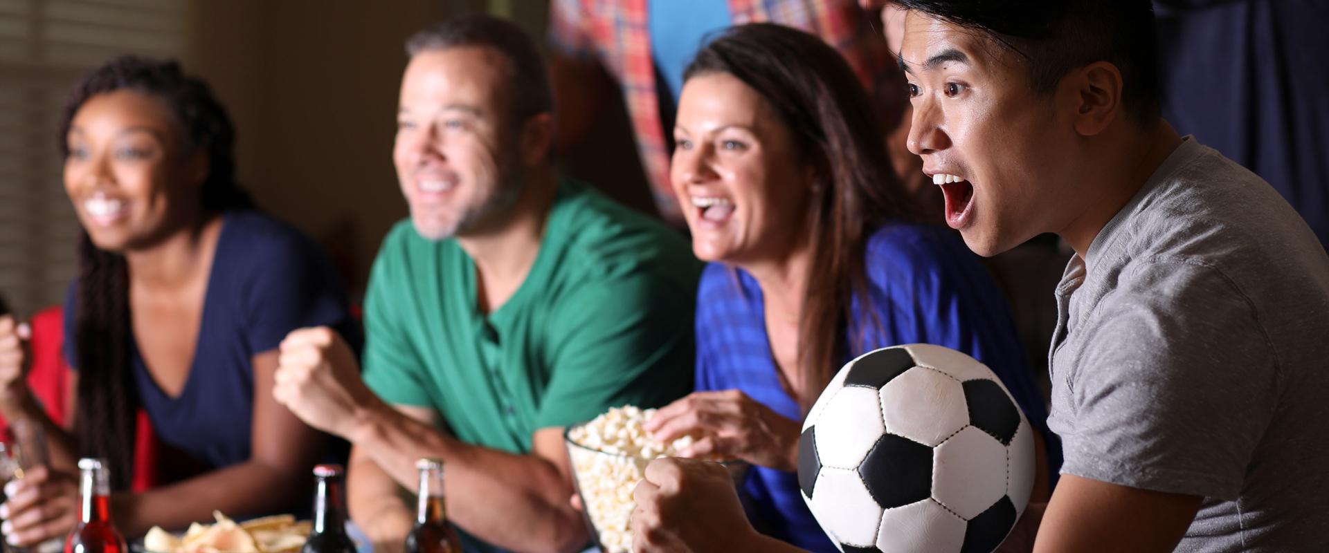 Friends watching football on tv