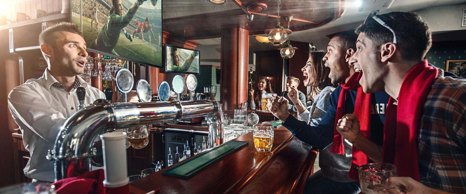 people watching football in pub