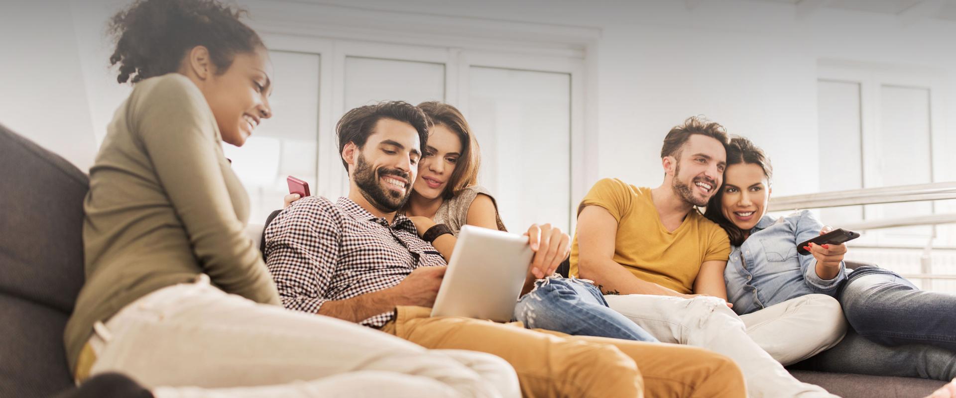 friends watching tv and tablet