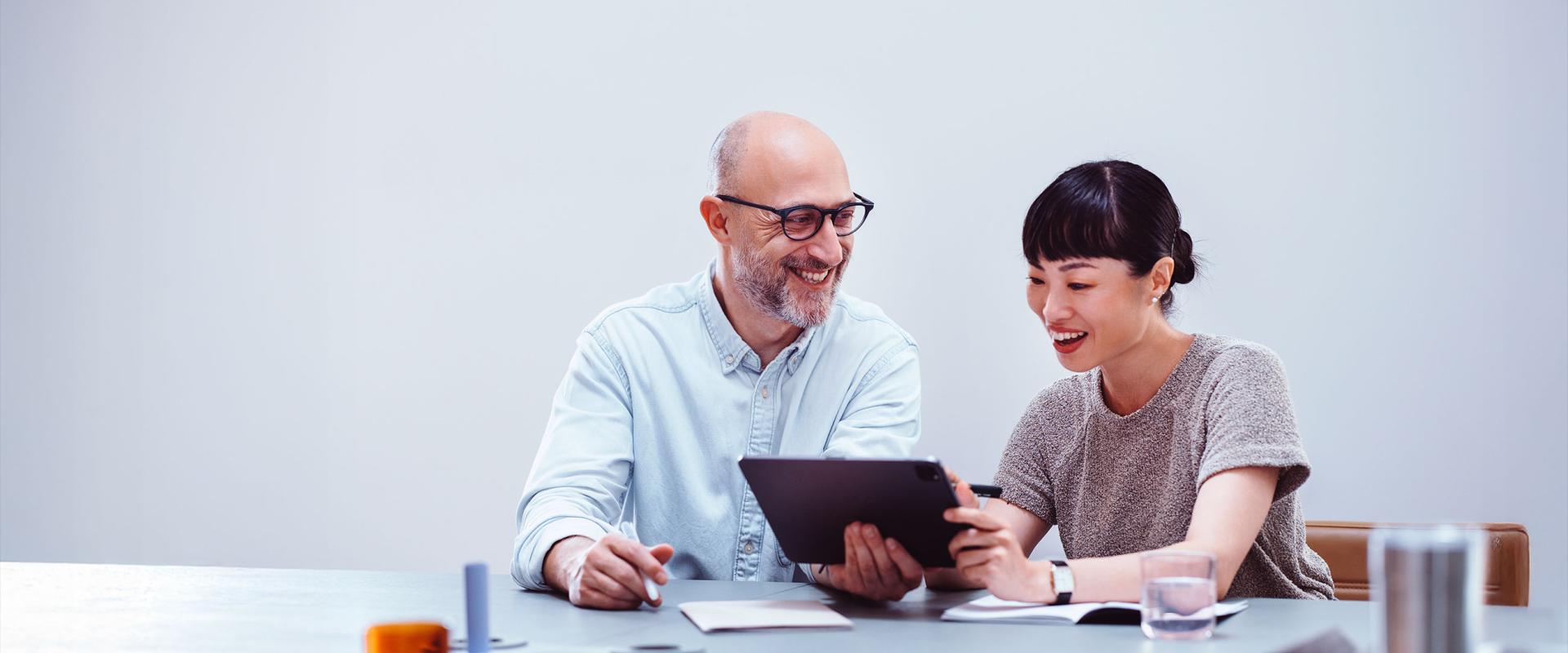 colleagues collaborating with tablet