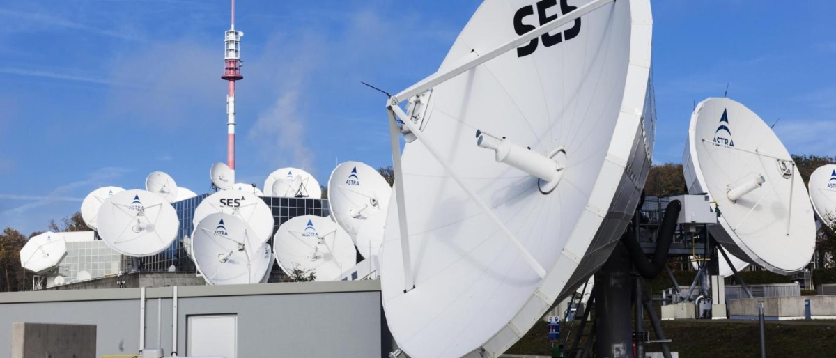 Image of multiple SES antennas mounted on top of buildings.