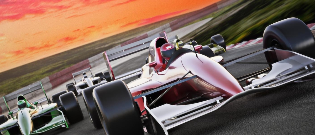 Image of race cars behind one another on track.