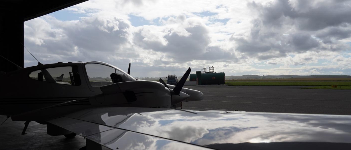 Image of an Airplane parked on a runway.