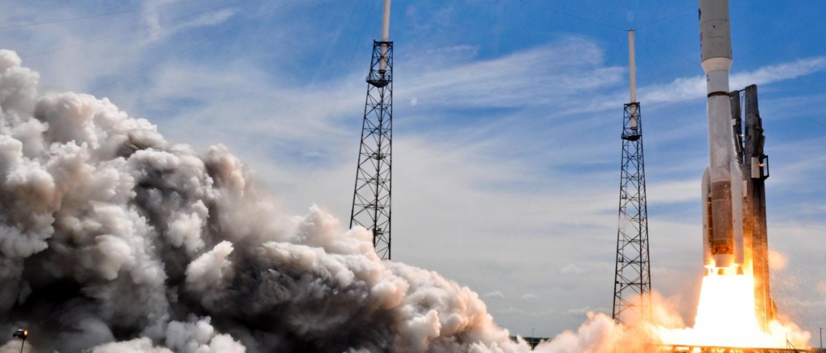 Image of a rocket lifting off surrounded with large clouds of exhaust.