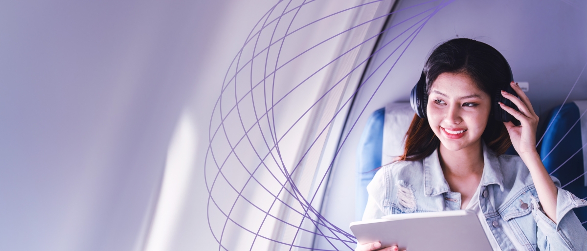 woman with headphones on airplane