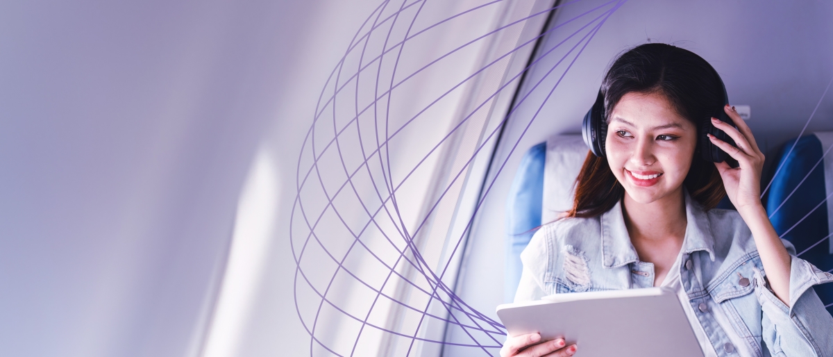 woman with headphones on airplane