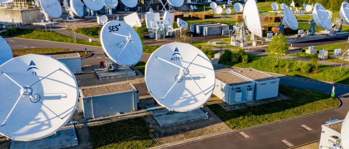 Image of antenna dishes in a field.