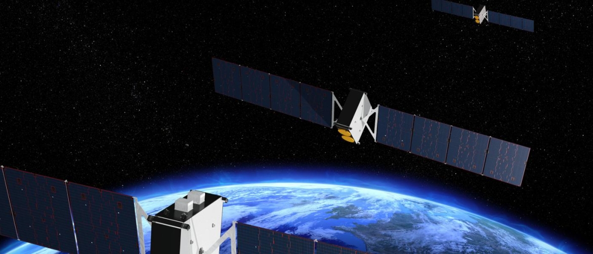 Image of satellites orbiting above Earth with solar panels extended.