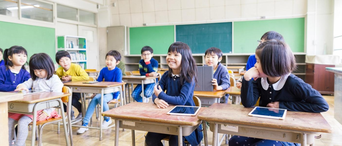 Image of students in a classroom using tablets.