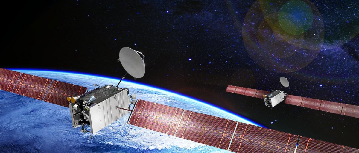 Image of two satellites orbiting above Earth against a starry space background.