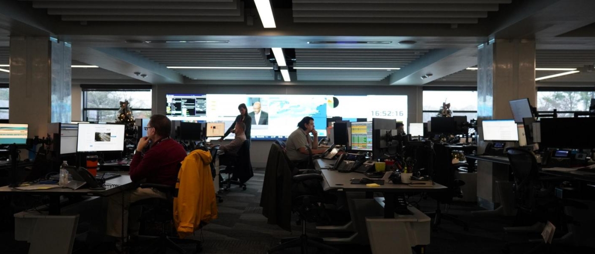 Image of staff working at computer stations in an operations facility