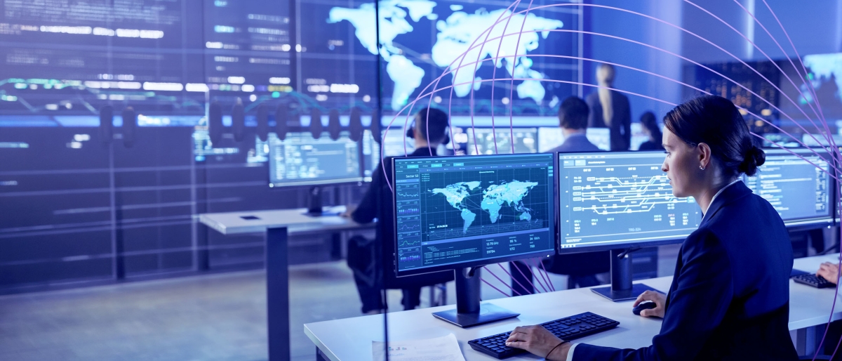 woman observing multiple screens