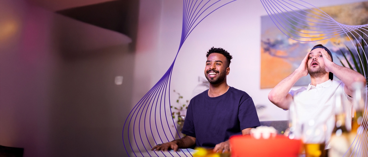 two men watching sports on television