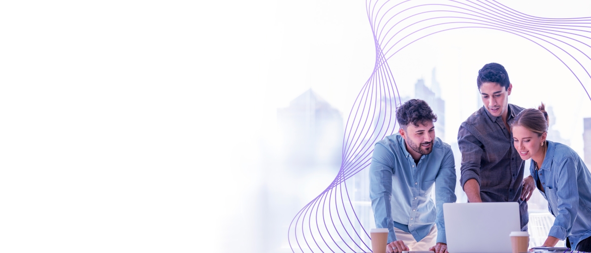 coworkers looking at a laptop