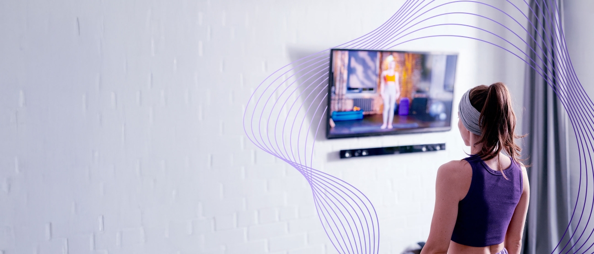 woman exercising and watching tv