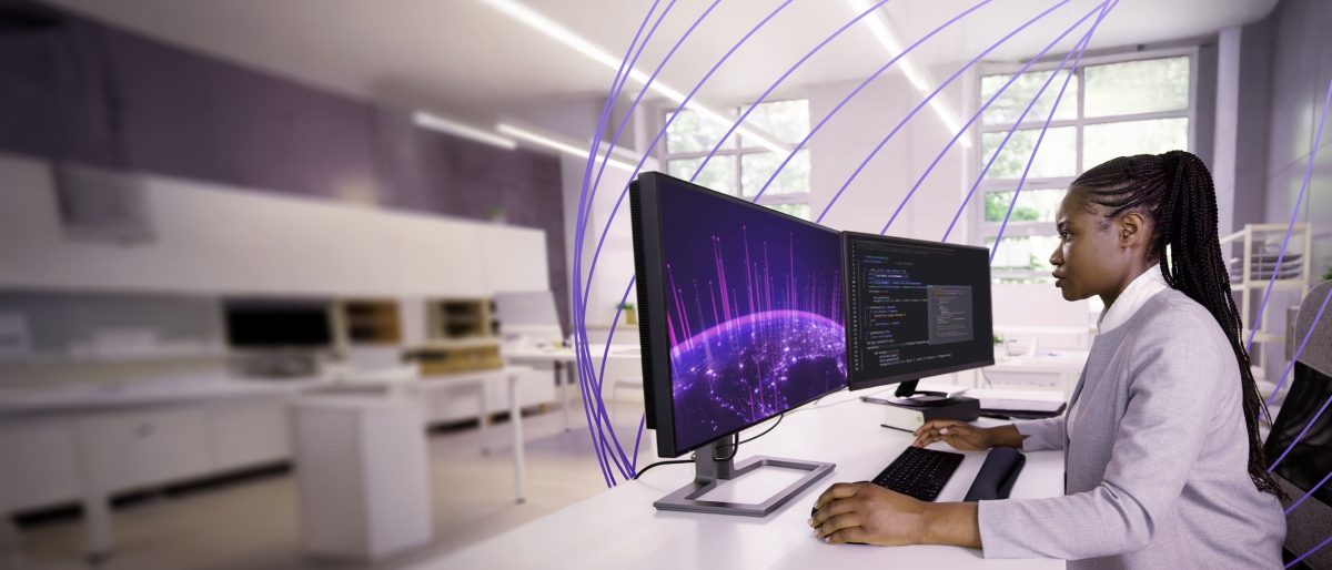 Woman monitoring computer screens