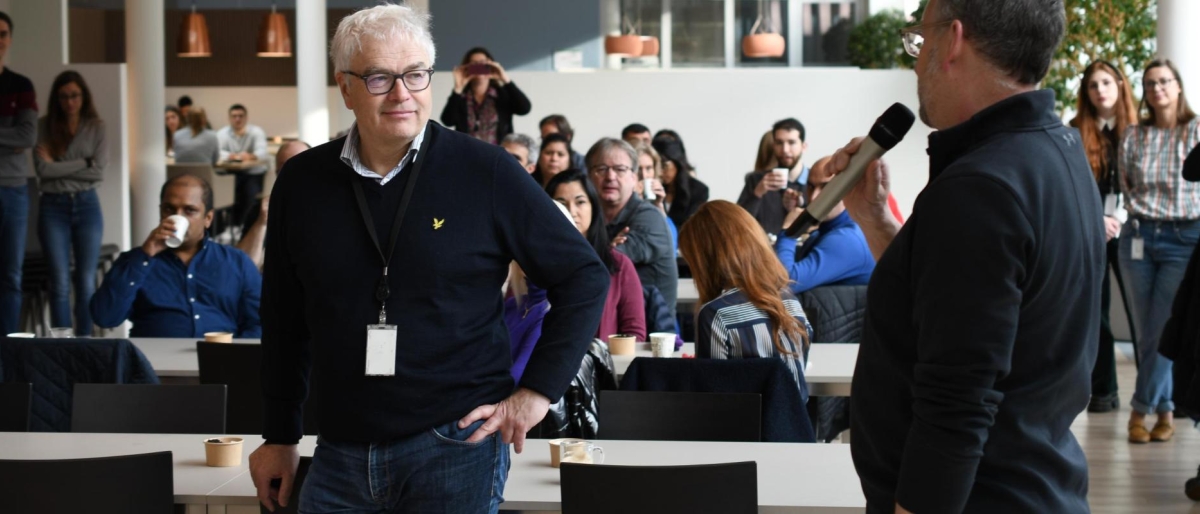 Image of John Baughn in a room with other people