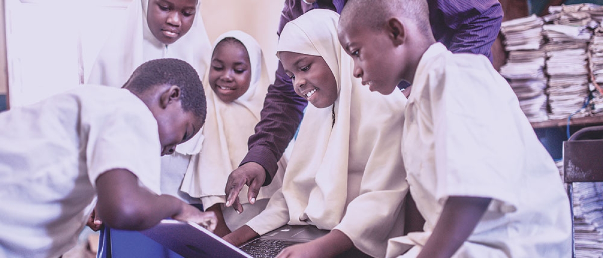 Teacher with students in African country