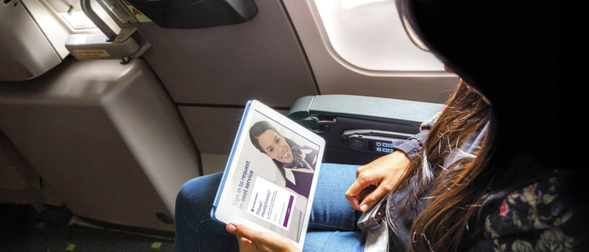 Airline passenger watching video on tablet