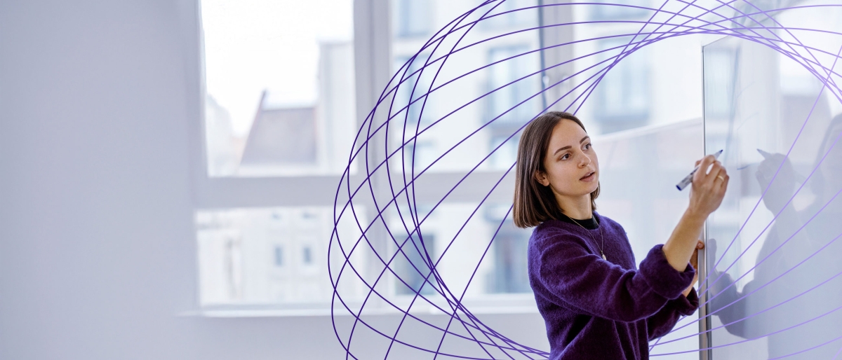 woman writing on whiteboard