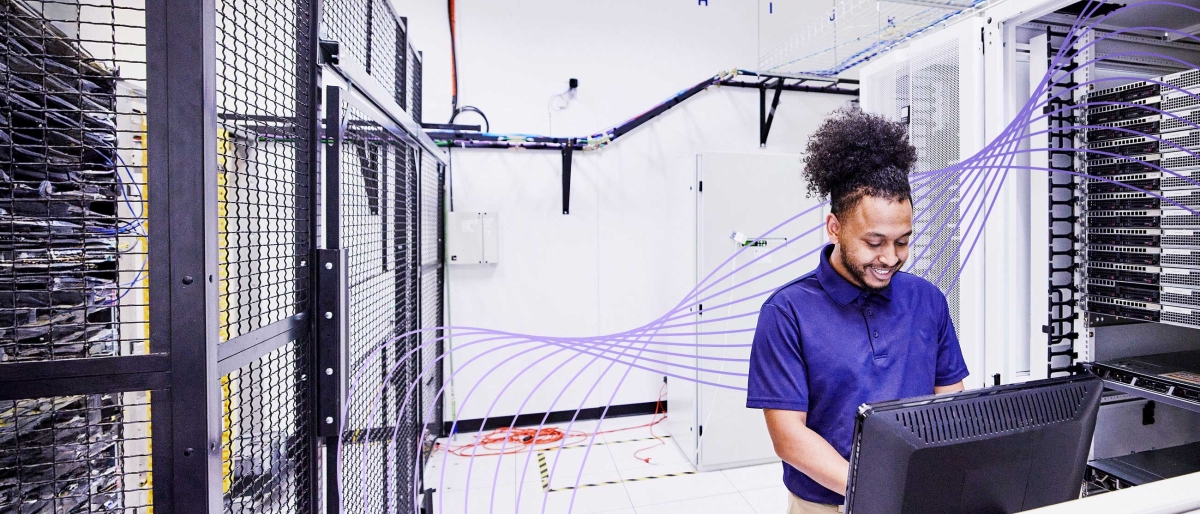 man working in server room
