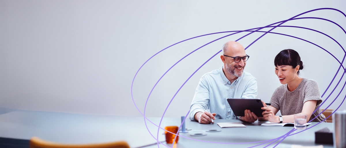 coworkers looking at tablet