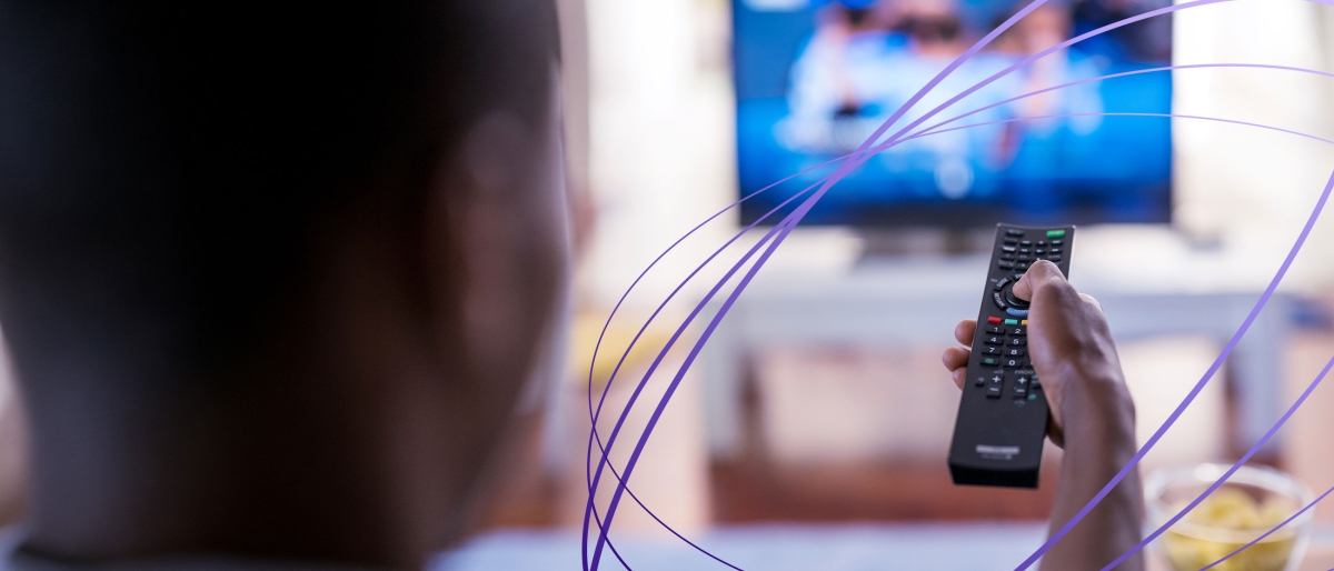 man using tv remote