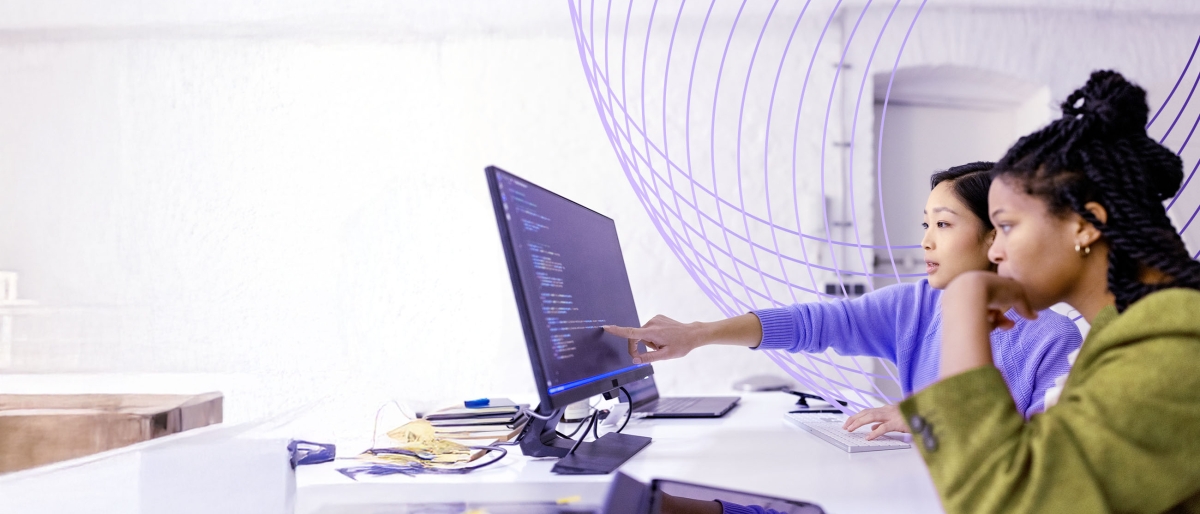 young women using a touchscreen computer