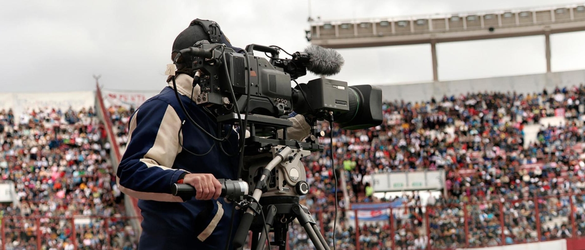 Image of a Videographer shooting in a stadium