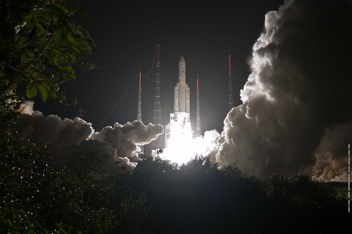 rocket lifting off at night