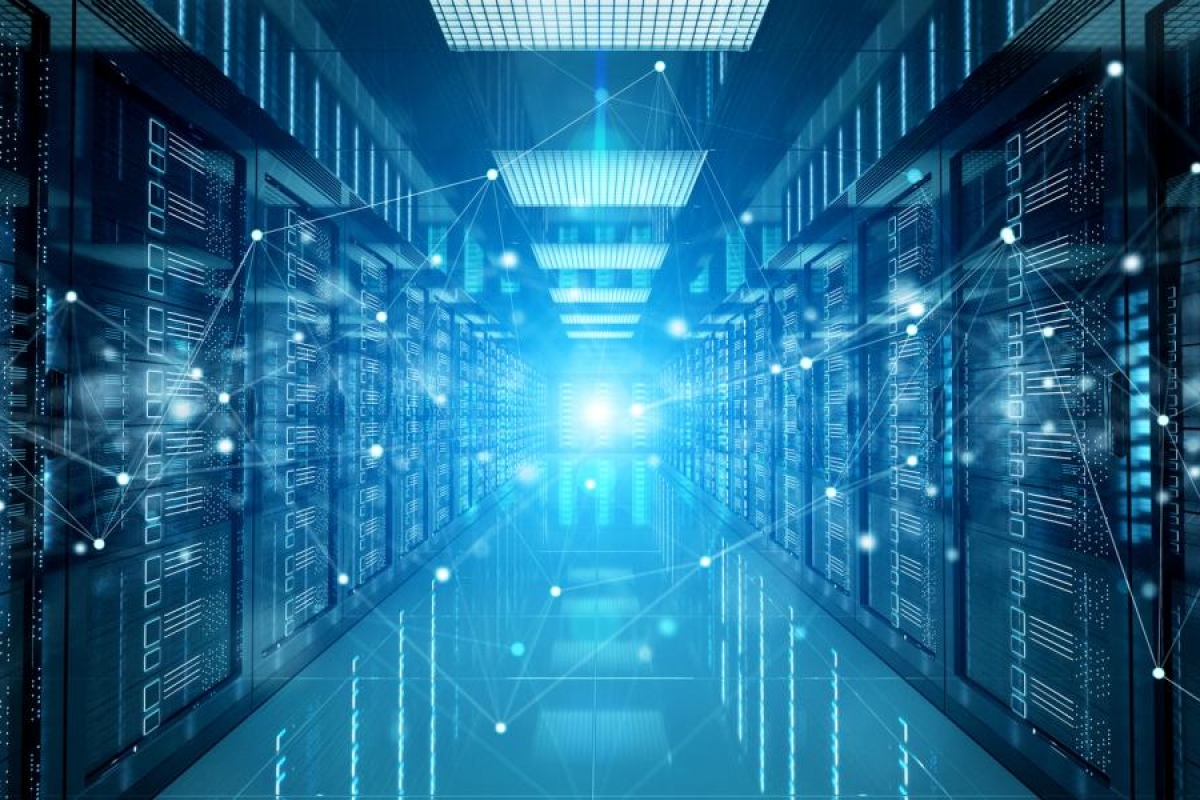 Image of a blue digital data center corridor with glowing servers.