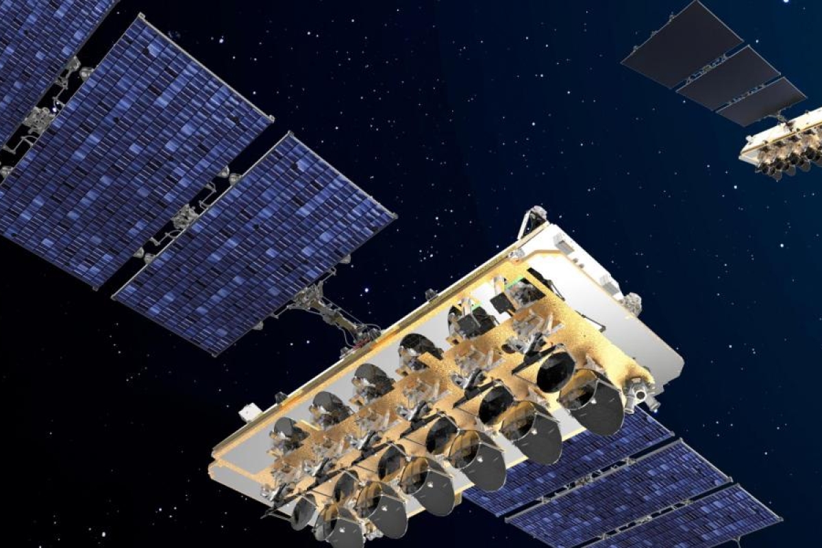 Image of O3b satellites with large solar arrays orbiting in space.