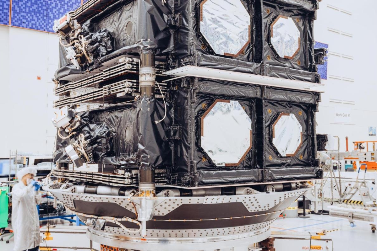 Image of two O3b mPOWER satellites stacked in a cleanroom