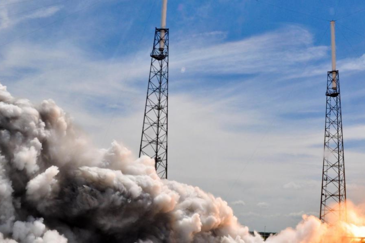 Image of a rocket lifting off surrounded with large clouds of exhaust.